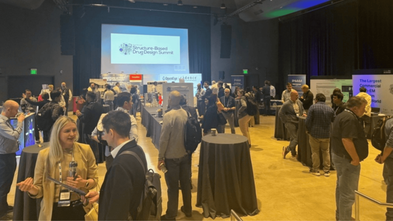 Professionals networking and attending a scientific conference focused on rational drug design and drug discovery innovation.