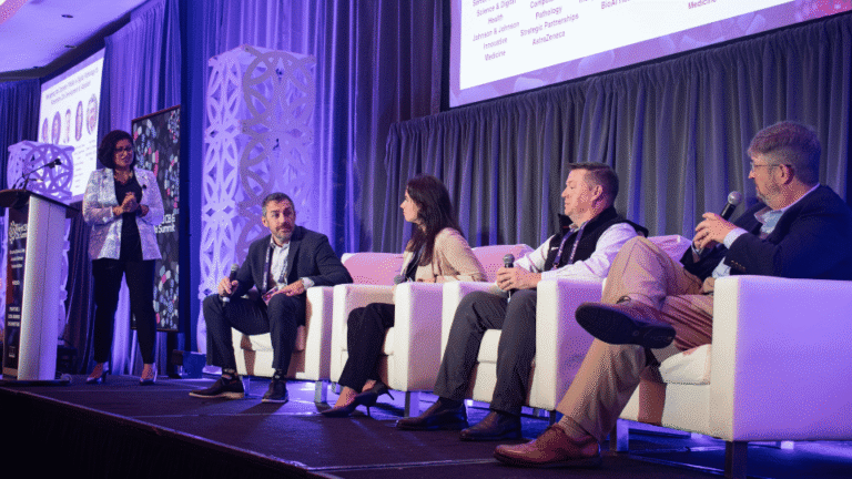 Scientists and industry leaders discussing emerging innovations in drug discovery.