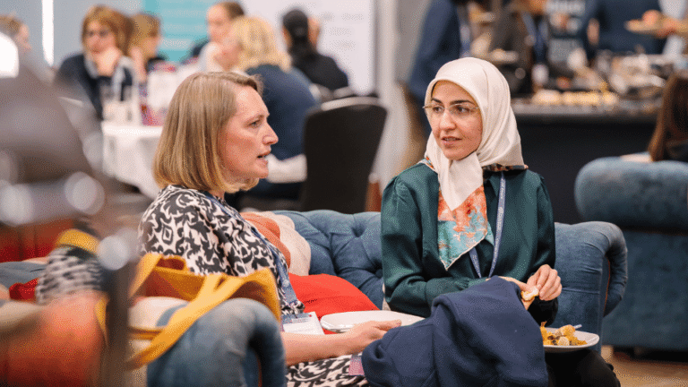 Professionals networking and building relationships at a scientific conference.